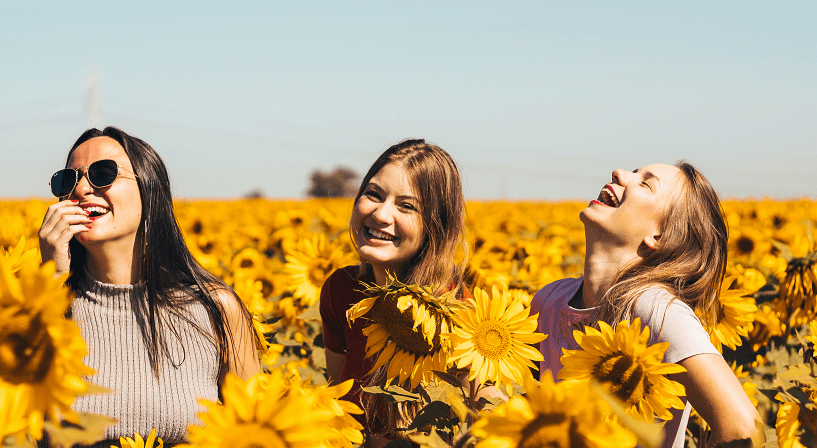 3 women-laughing-sunflowers