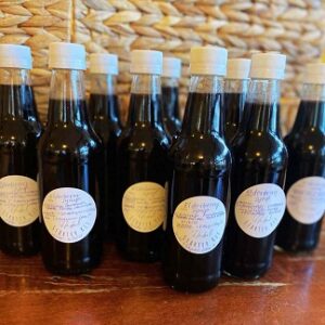 Bottles of Elderberry Syrup. Winter wellness and herbs to boost immunity.