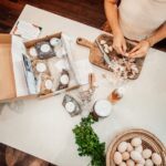 Photo of DIY Herbal Starter Kit kit from above, making immune tonic in kitchen