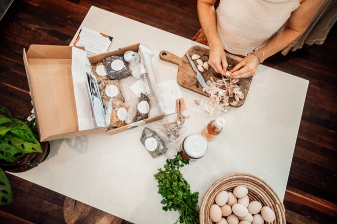 Photo of DIY Herbal Starter Kit kit from above, making immune tonic in kitchen