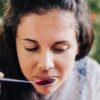 woman tasting herbal medicine. Knowing herbal tastes help us become more confident home herbalists. An Everyday Empowered course.