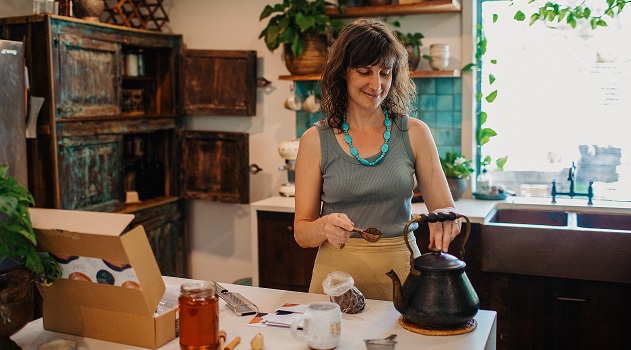woman tasting herbal medicine. Knowing herbal tastes help us become more confident home herbalists. An Everyday Empowered course.