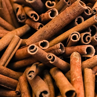 image of pile of cinnamon sticks. herbs for winter wellness. herbs as immune boosters.