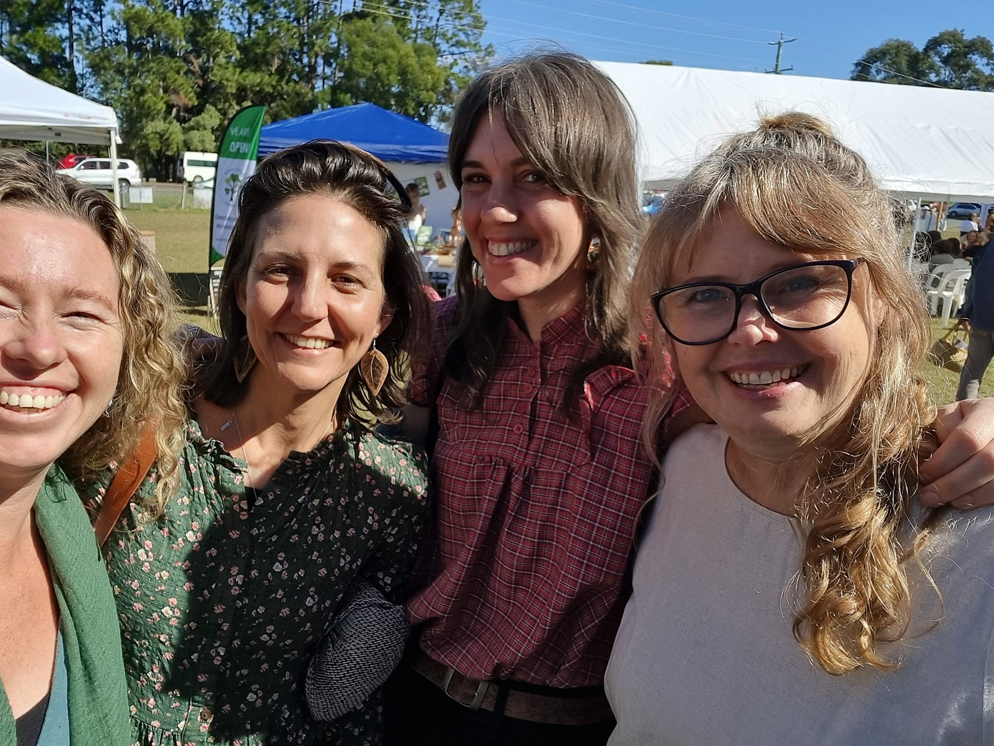 Image of 4 women standing together at HerbFest, community herbal medicine event on the Sunshine Coast